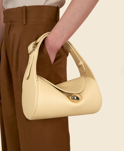 Cafuné Drop Duffel in Cream on model view